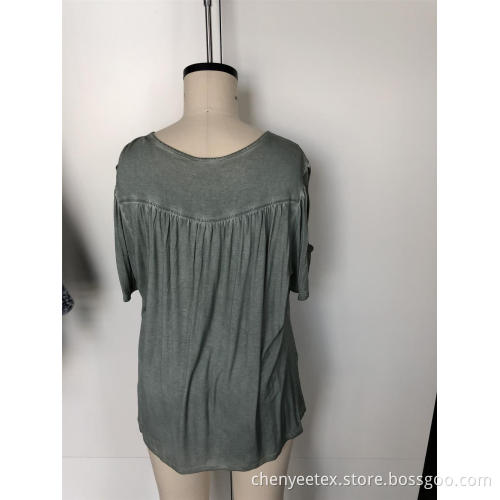 A short-sleeved blouse with tassel cut out